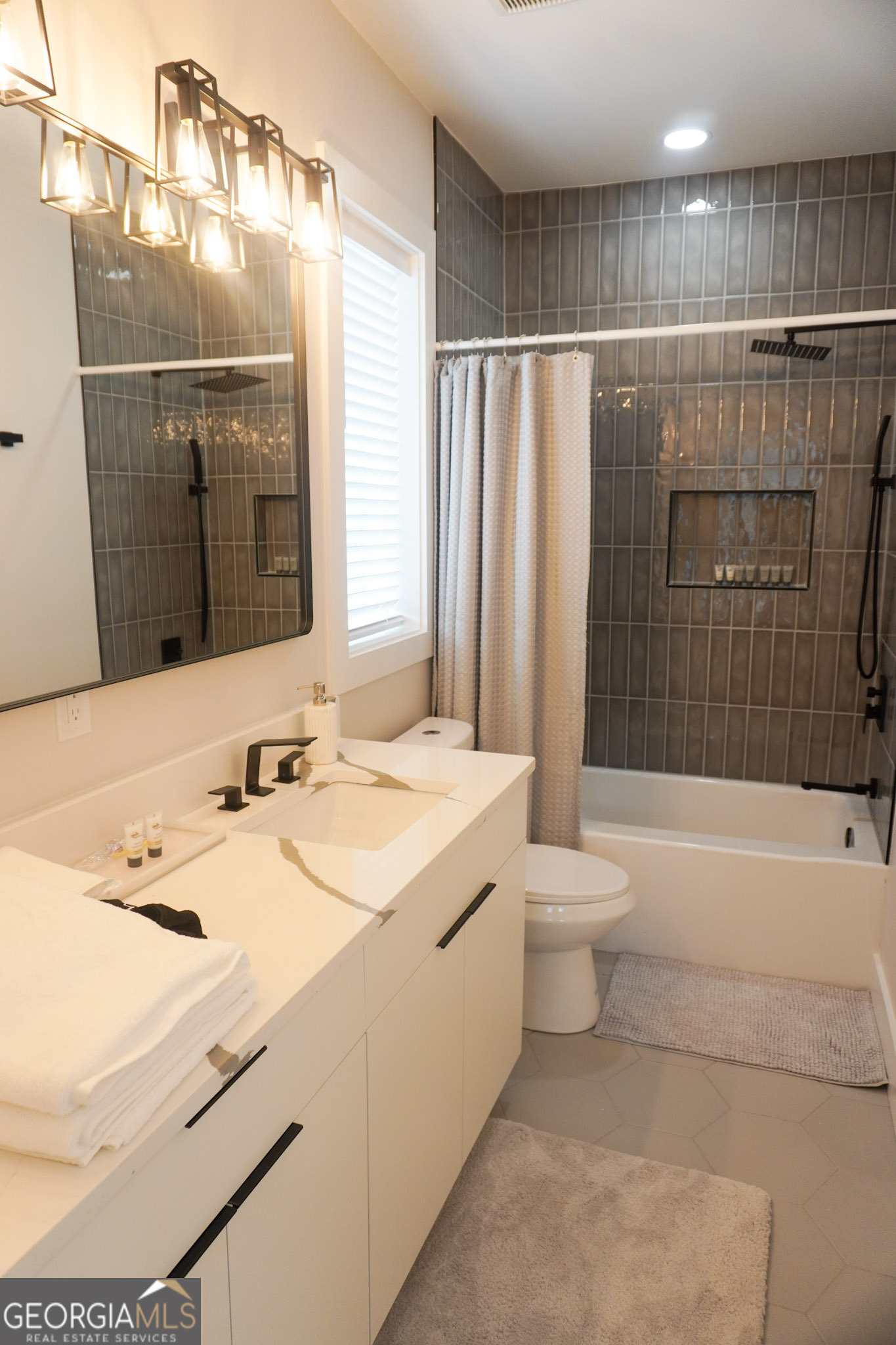 68 Boulevard Southeast Atlanta, GA 30312 - Photo 33 of 51 a bathroom with a sink a toilet and shower