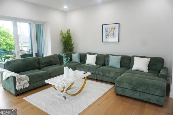 a living room with fireplace furniture and a flat screen tv