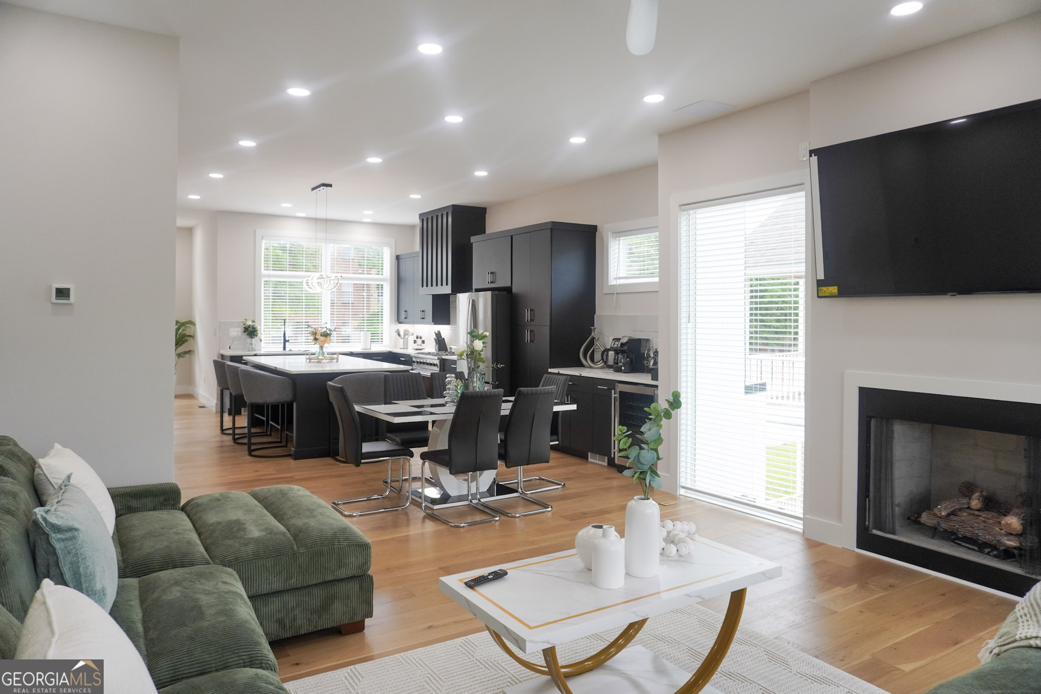68 Boulevard Southeast Atlanta, GA 30312 - Photo 42 of 51 a living room with furniture a flat screen tv and a fireplace