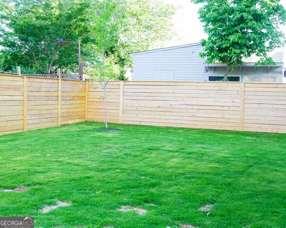 a view of a front door and wooden floor