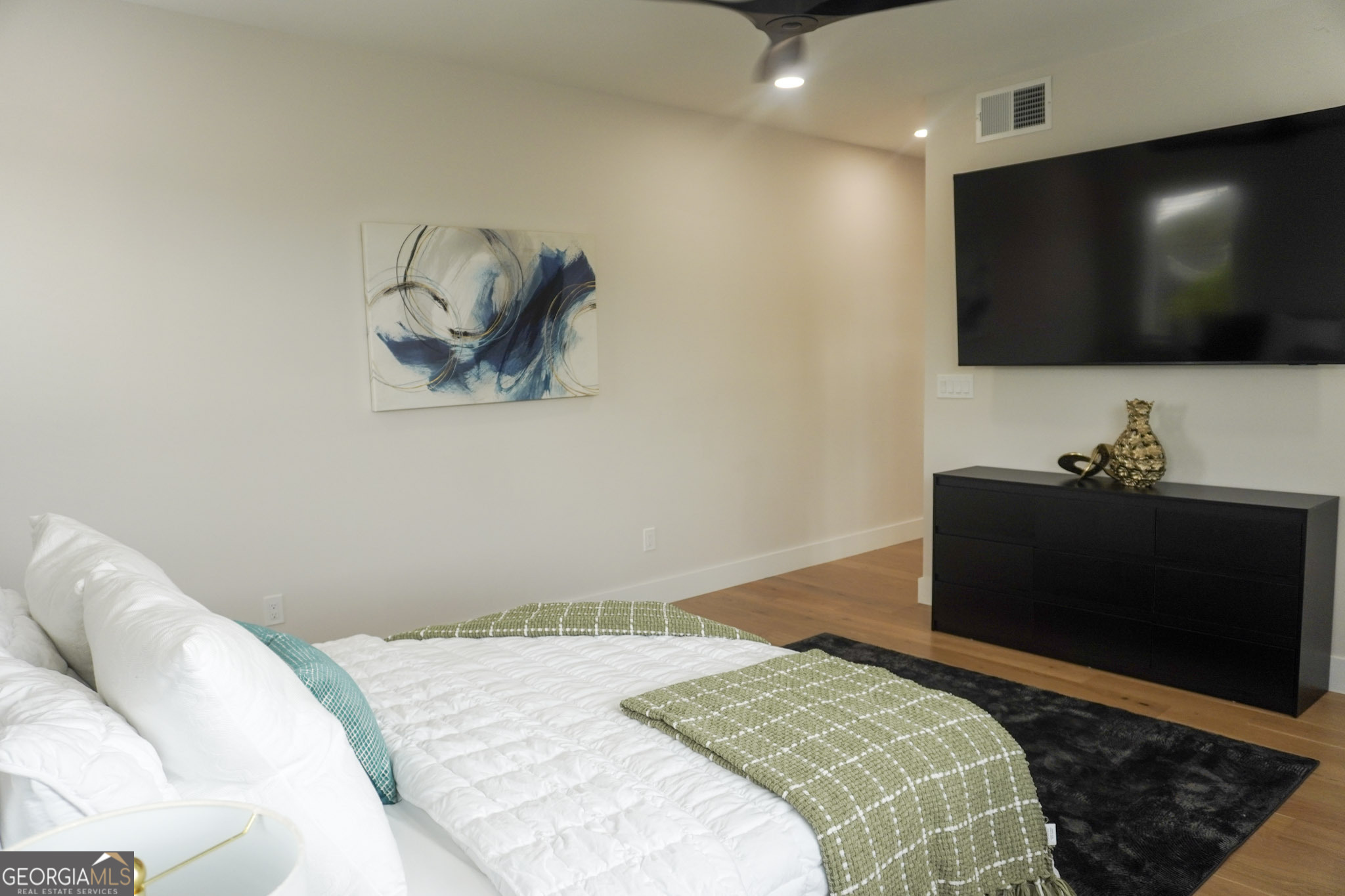 68 Boulevard Southeast Atlanta, GA 30312 - Photo 6 of 51 a bedroom with a bed and a flat screen tv