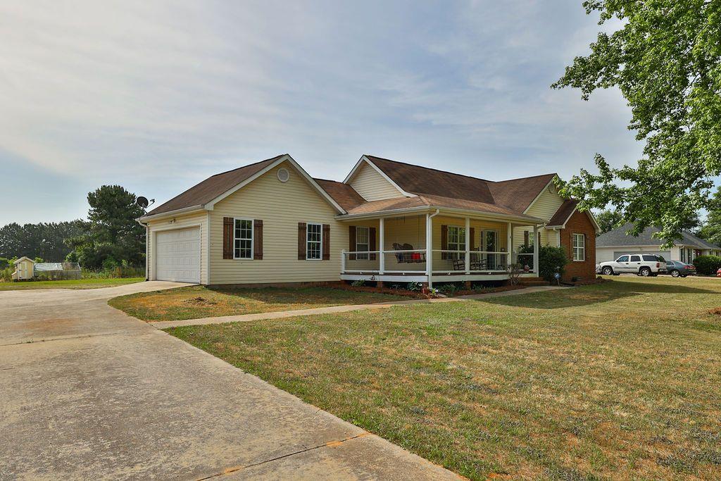 222 Queens Cemetery Road Good Hope, GA 30641 - Photo 1 of 1 a view of a house with a yard and sitting area