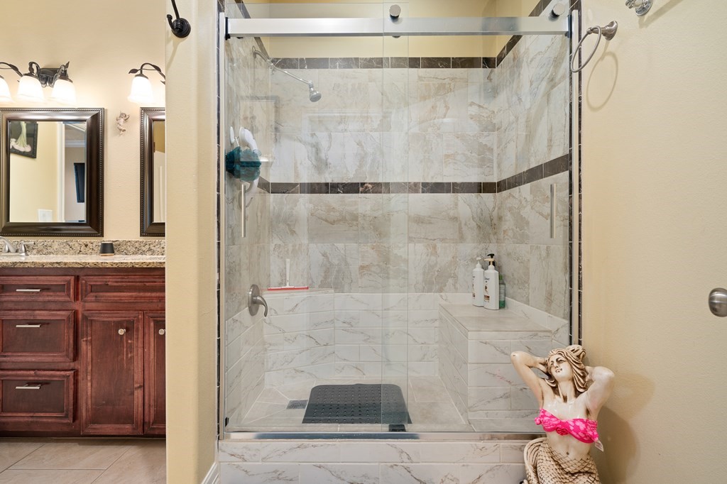 104 Sandollar Circle Fulton, TX 78382 - Photo 15 of 24 a bathroom with a shower and a mirror