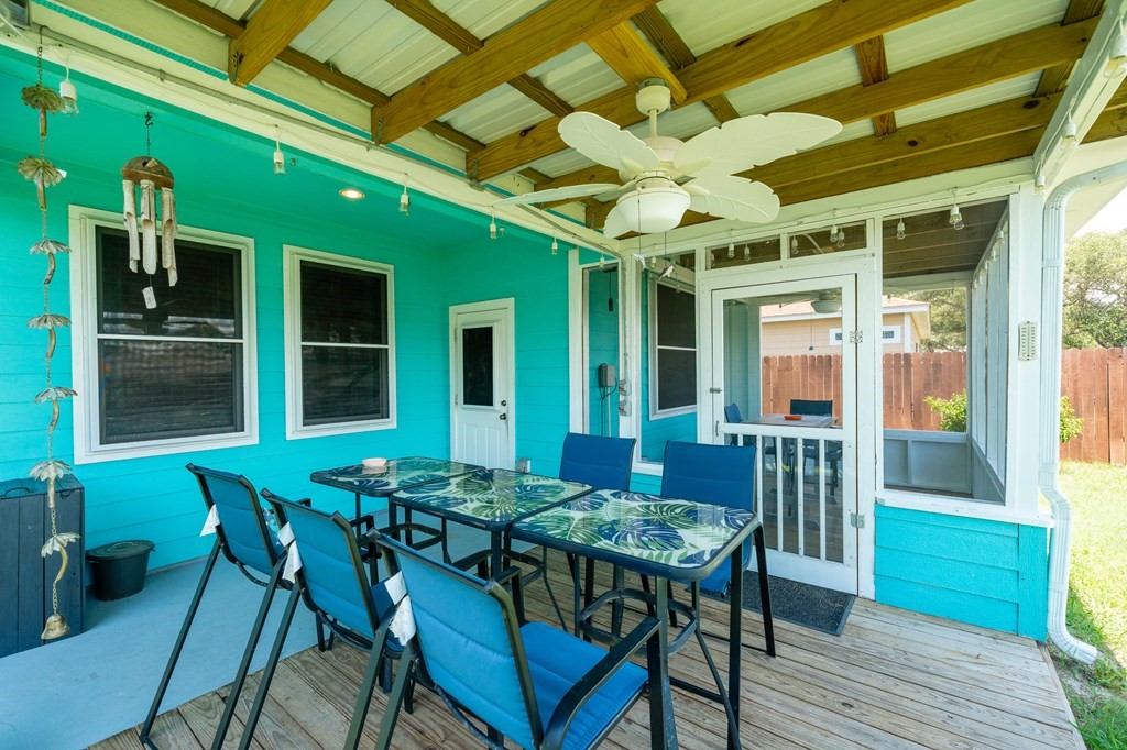 104 Sandollar Circle Fulton, TX 78382 - Photo 17 of 24 a view of a dining table and chairs in porch