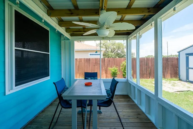 a view of a dining room with furniture and a window