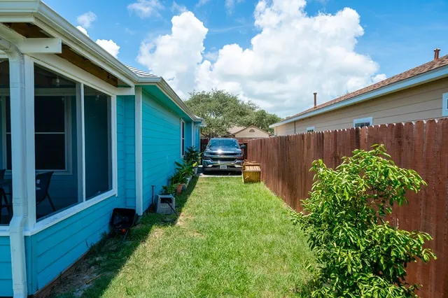 a backyard of a house with lots of green space