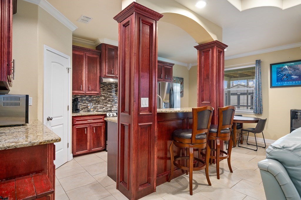 104 Sandollar Circle Fulton, TX 78382 - Photo 7 of 24 a view of kitchen with granite countertop breakfast area