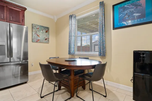 a view of a dining room with furniture window and outside view