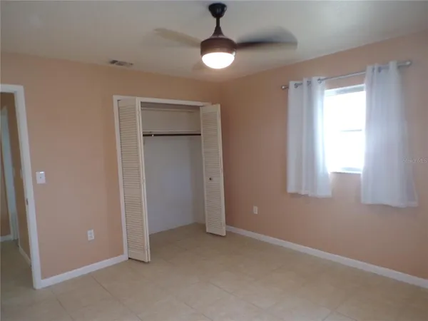 a view of an empty room with a window