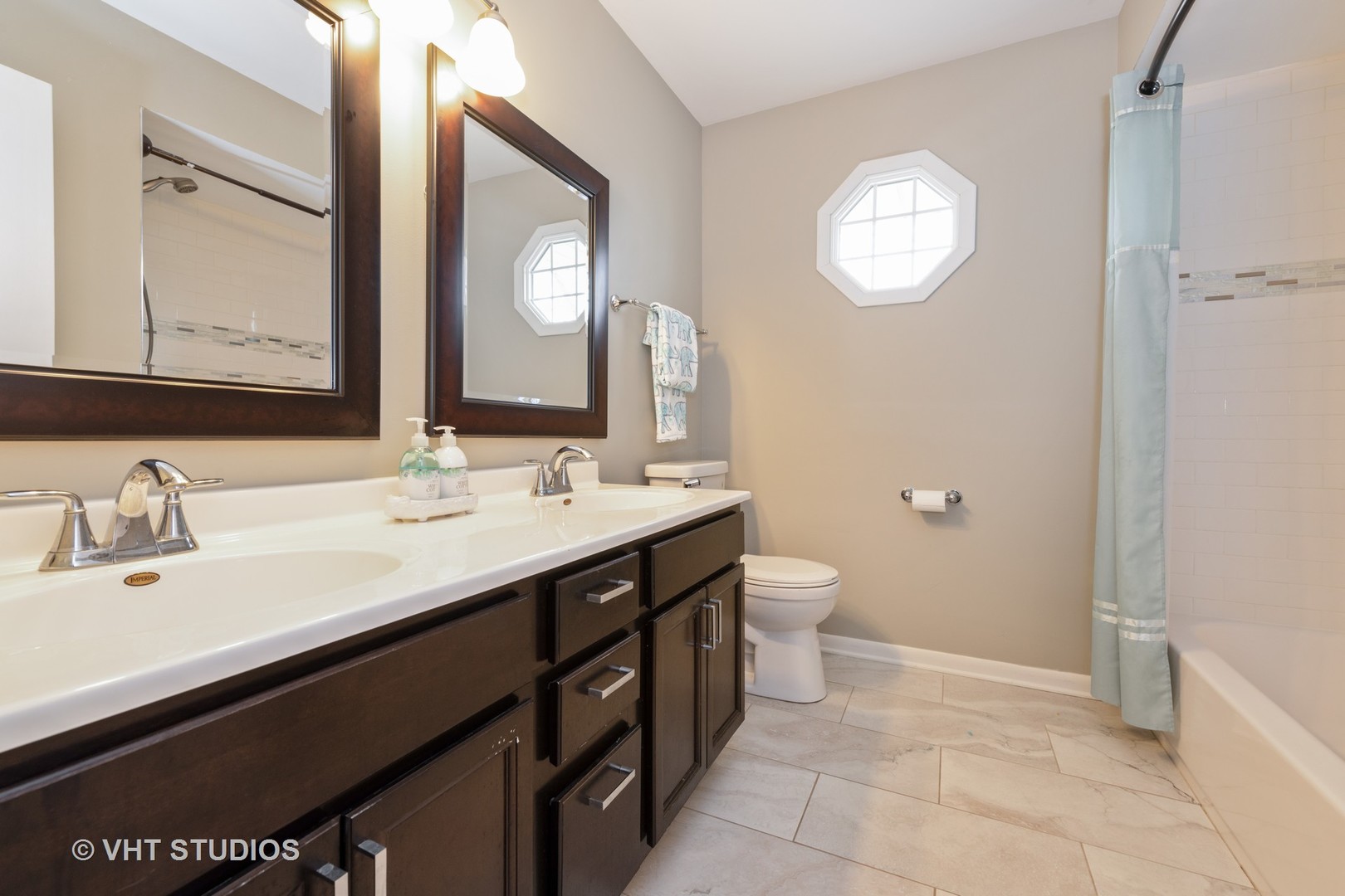 29-w021 Wagner Road Naperville, IL 60564 - Photo 11 of 12 a bathroom with a double vanity sink and a mirror