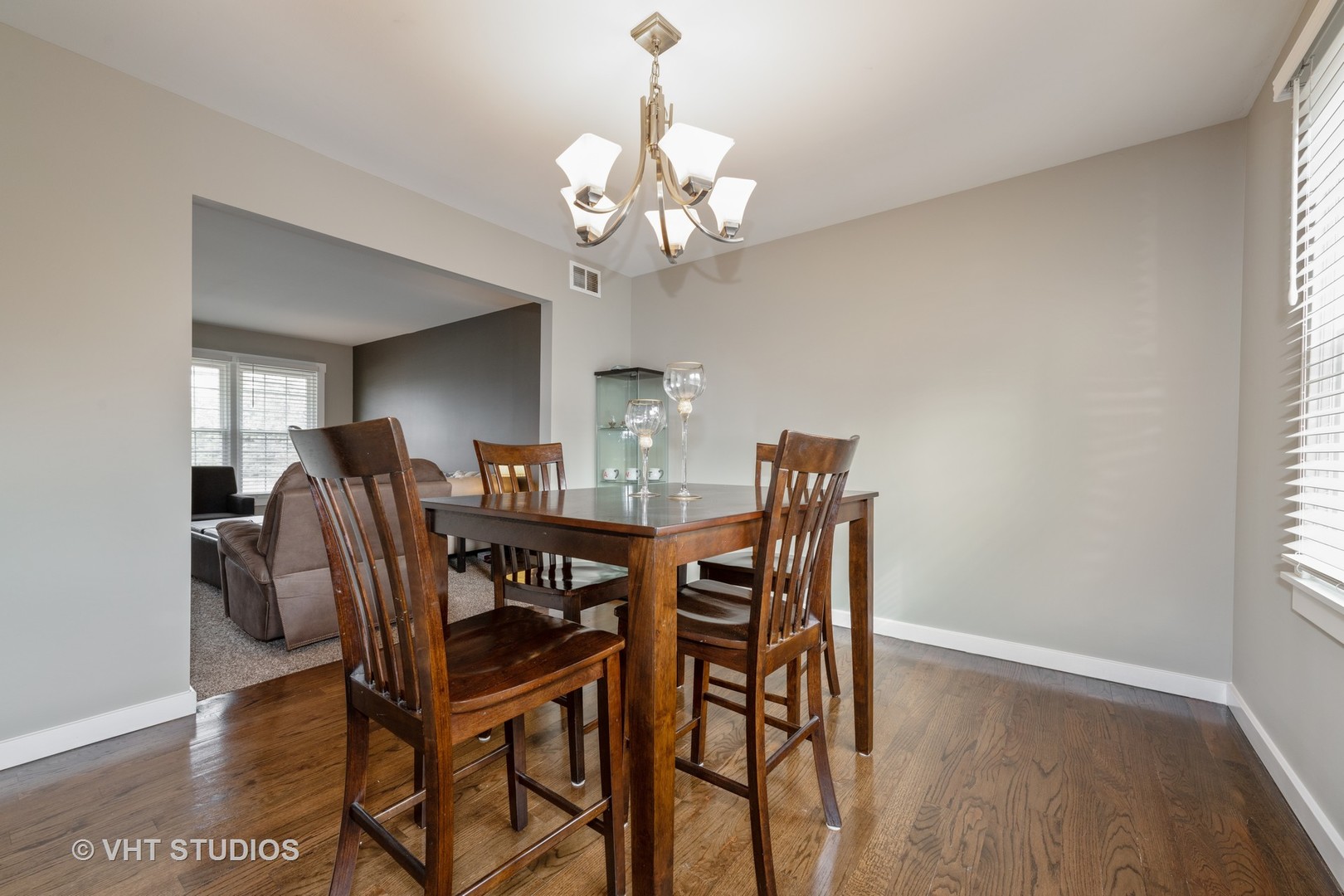 29-w021 Wagner Road Naperville, IL 60564 - Photo 4 of 12 a view of a dining room with furniture and wooden floor