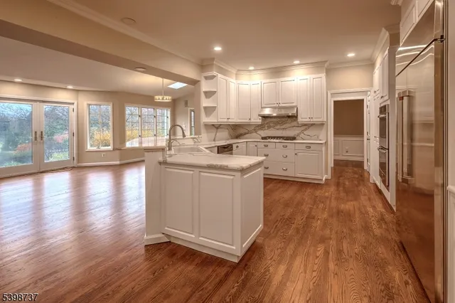 a kitchen with a white stove top oven and refrigerator