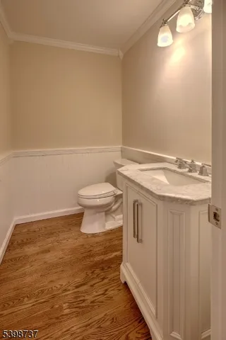 a bathroom with a sink a toilet and a window