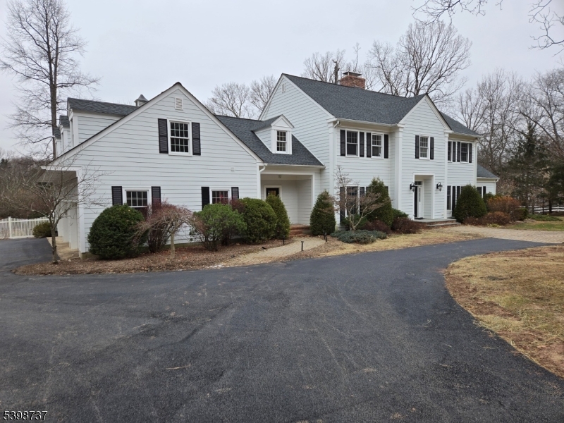36 Calais Road Mendham, NJ 07945 - Photo 30 of 30 a front view of a house with a yard