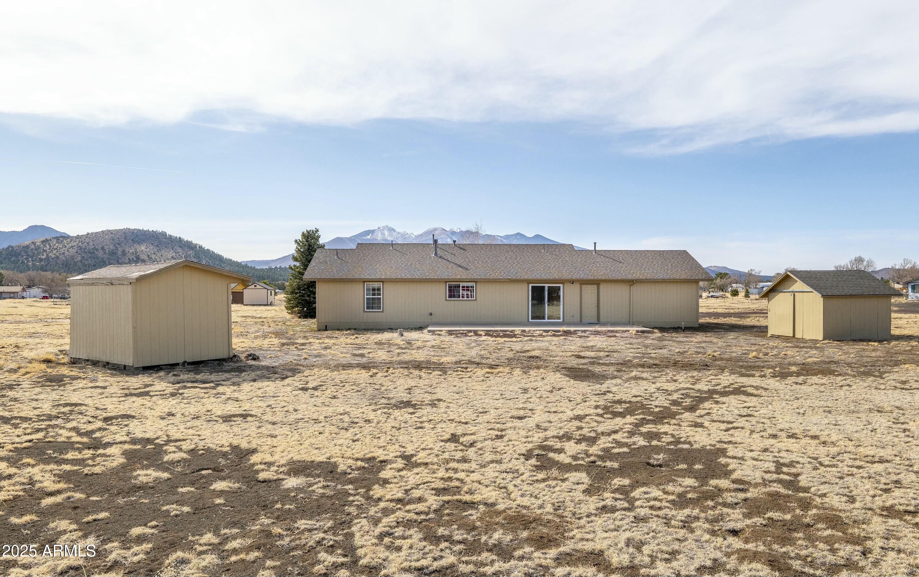 8080 Wendy's Way Flagstaff, AZ 86004 - Photo 15 of 18 a large house with a large tree in front of it