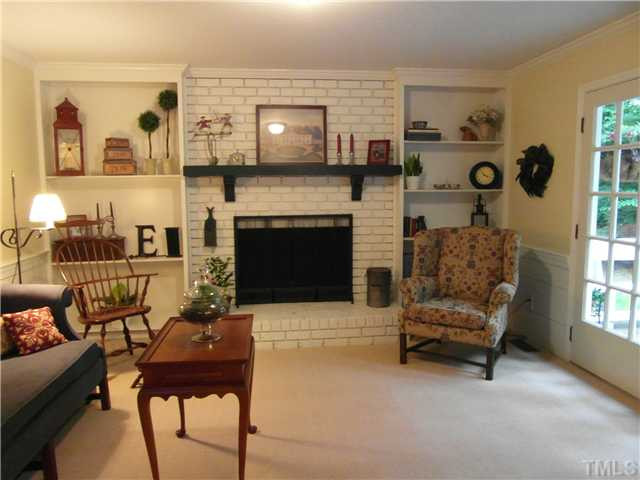 11805 Coachmans Way Raleigh, NC 27614 - Photo 6 of 25 Family Room with Wood Burning Fireplace and Built in Book Shelves. Leads to Deck!