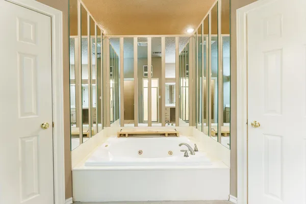 a bathroom with a sink a vanity and a window