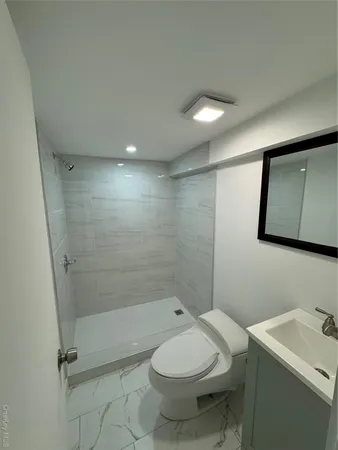 a view of a living room with wooden floor