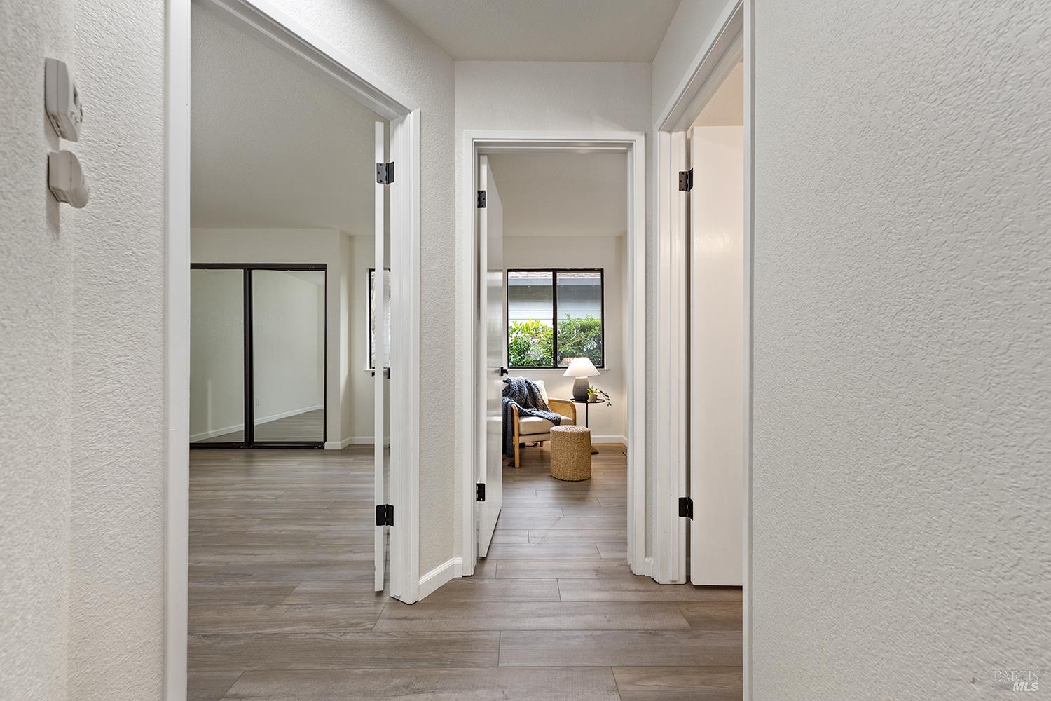 1733 Burgundy Place Santa Rosa, CA 95403 - Photo 15 of 23 Hallway with bedrooms and a bathroom situated away from the primary bedroom.