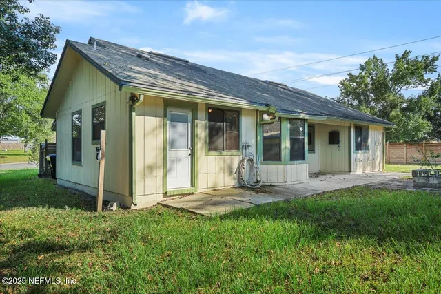 front view of a house with a yard