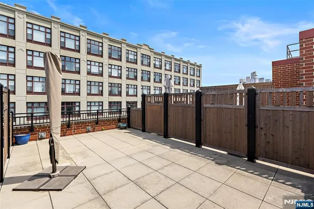 a view of building with glass door