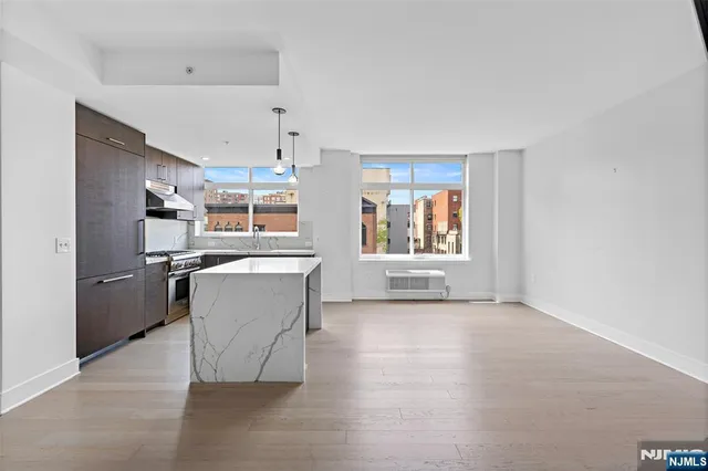 a view of a kitchen with furniture and a window