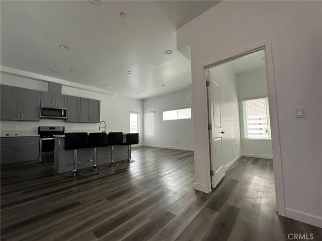 a view of kitchen with sink and cabinets