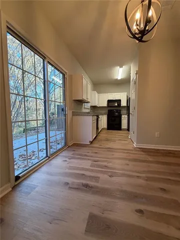 a view of a kitchen with a sink and cabinets