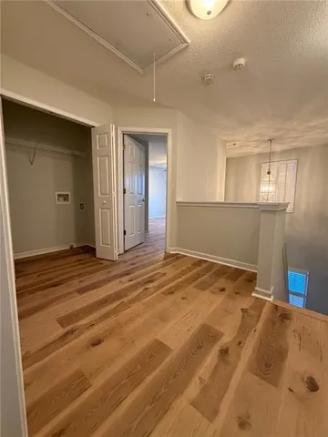 a bedroom with a bed and cabinets