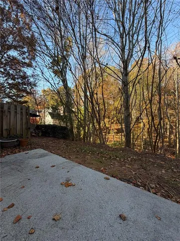 a backyard of a house with lots of green space