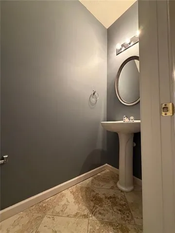 a bathroom with a toilet and a sink