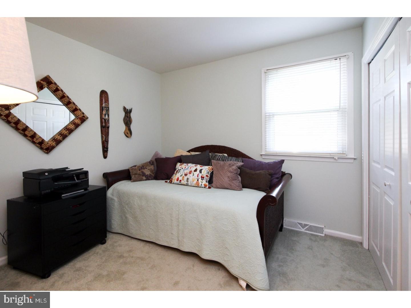 101 Greenvale Road Cherry Hill, NJ 08034 - Photo 17 of 25 a bedroom with a bed and wooden floor