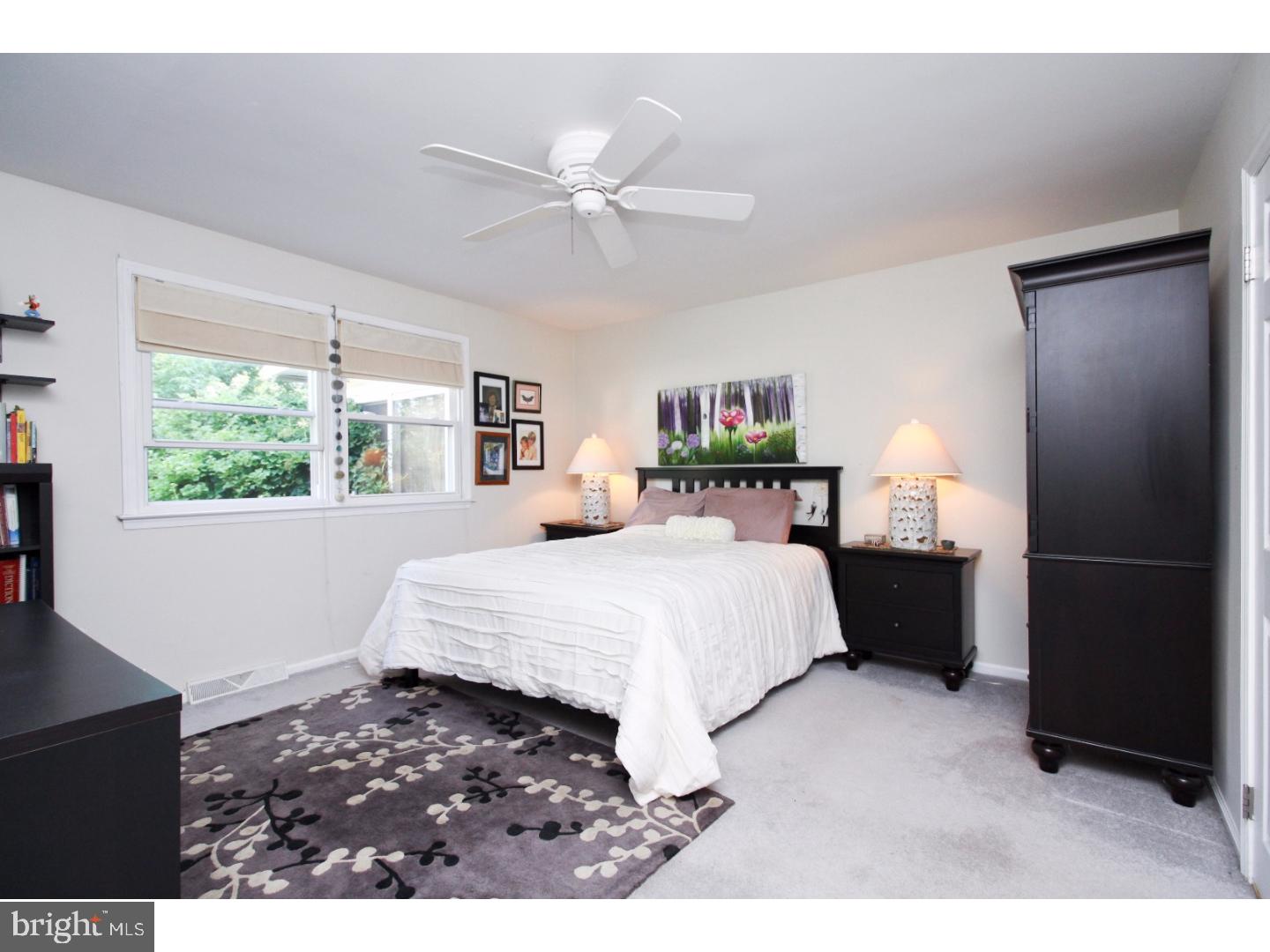 101 Greenvale Road Cherry Hill, NJ 08034 - Photo 20 of 25 a bedroom with a large bed and a window