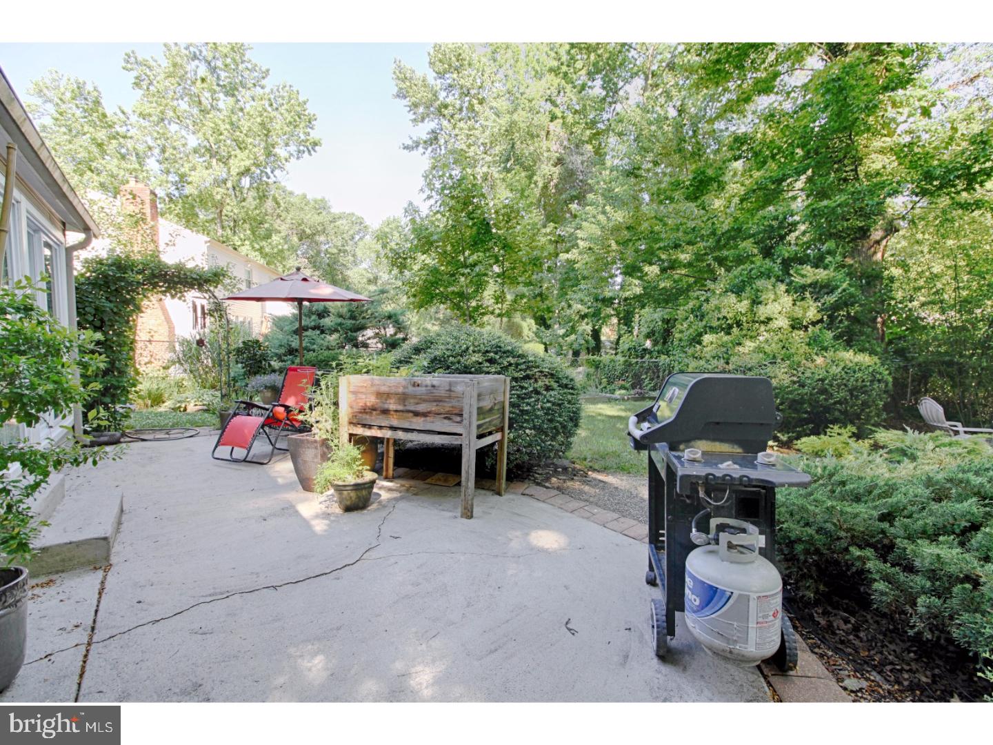 101 Greenvale Road Cherry Hill, NJ 08034 - Photo 23 of 25 a backyard of a house with a table and chairs