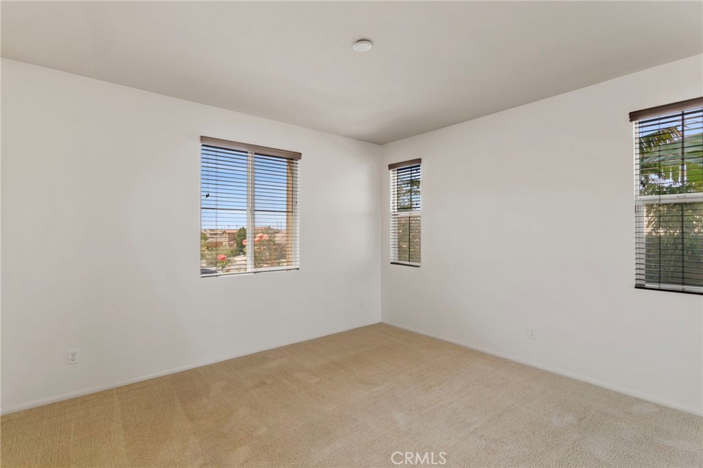 11462 Jacobsen Road Beaumont, CA 92223 - Photo 23 of 45 a view of an empty room with a window