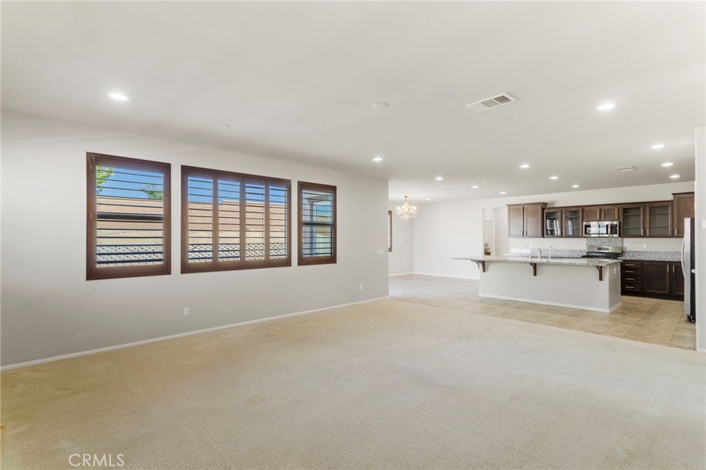 11462 Jacobsen Road Beaumont, CA 92223 - Photo 3 of 45 a view of an empty room with a window