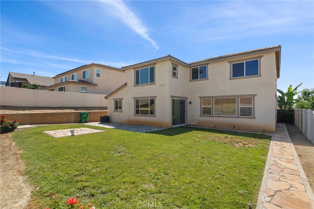 11462 Jacobsen Road Beaumont, CA 92223 - Photo 31 of 45 a view of a house with pool and a yard