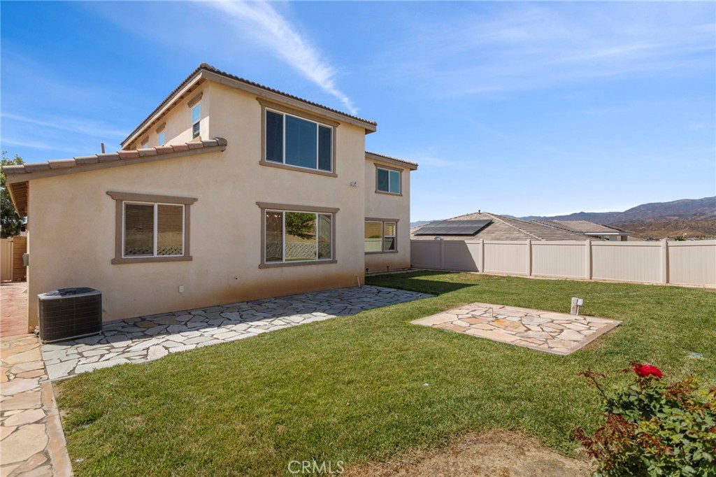 11462 Jacobsen Road Beaumont, CA 92223 - Photo 32 of 45 a front view of a house with a yard