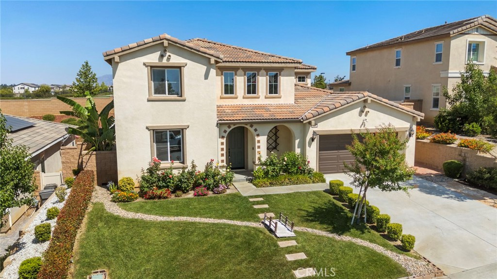 11462 Jacobsen Road Beaumont, CA 92223 - Photo 44 of 45 a front view of a house with a yard