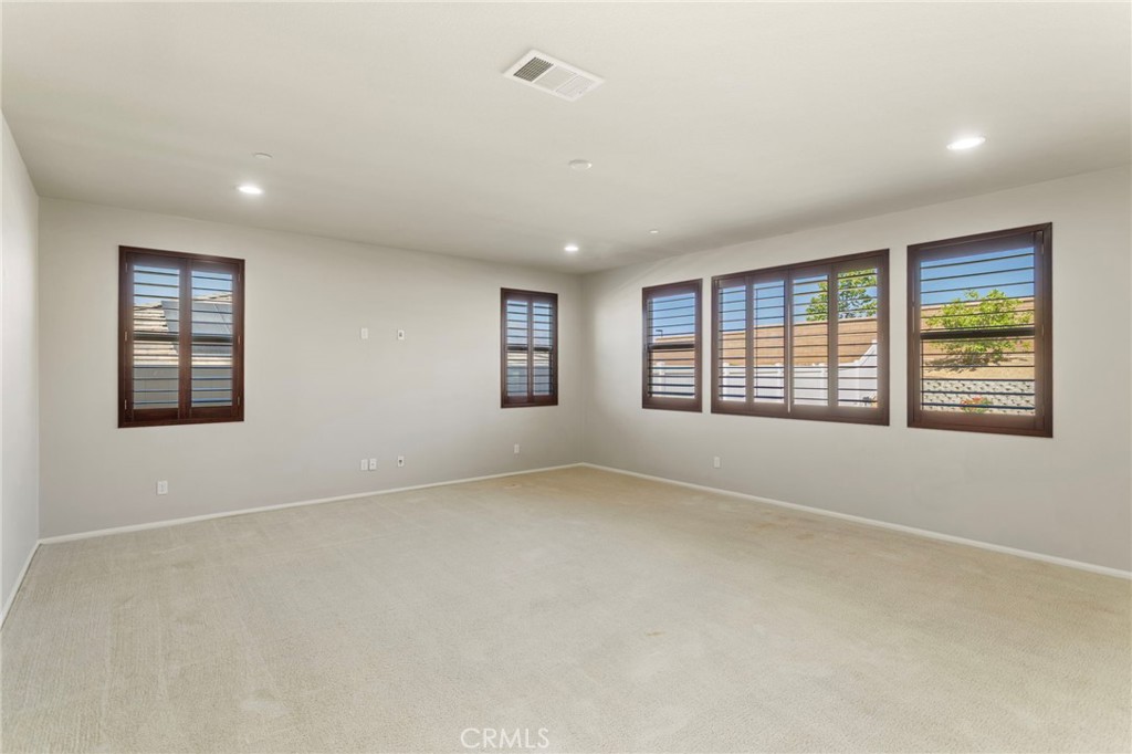 11462 Jacobsen Road Beaumont, CA 92223 - Photo 6 of 45 an empty room with windows