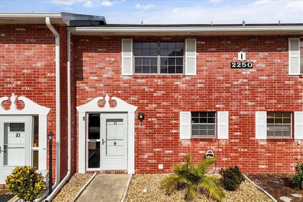 a front view of a building with brick walls