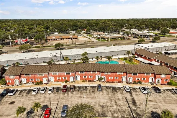 an aerial view of residential building with lake view