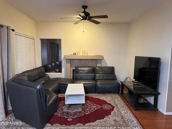 a kitchen with kitchen island granite countertop a sink cabinets and stainless steel appliances