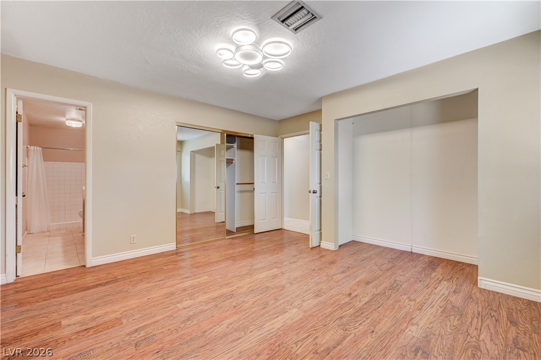 7631 Bermuda Road Las Vegas, NV 89123 - Photo 22 of 64 Streamlined flooring and ample closet space define this well-appointed sleeping area.