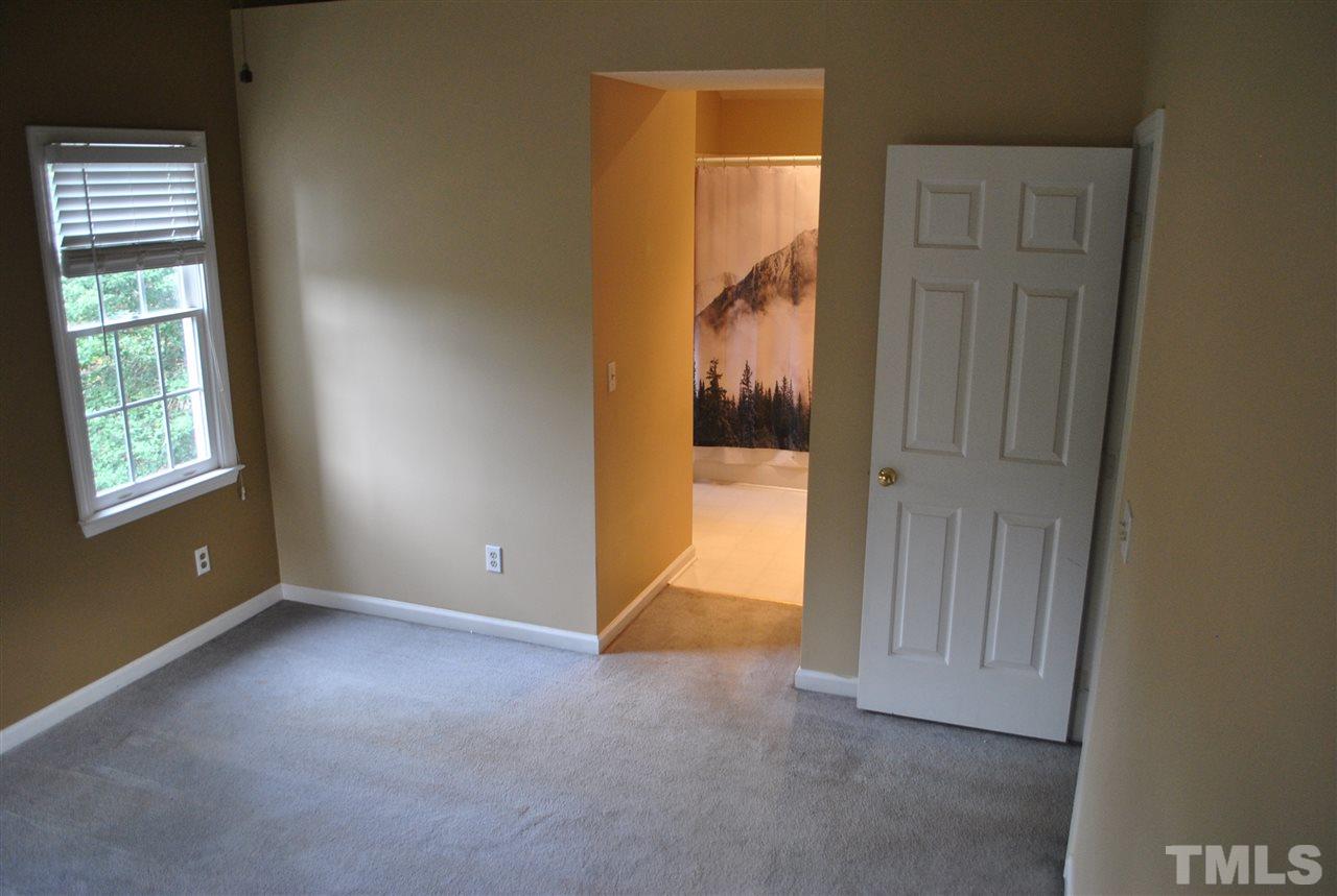 3424 Ribcowski Court Raleigh, NC 27616 - Photo 13 of 20 an empty room with windows and closet