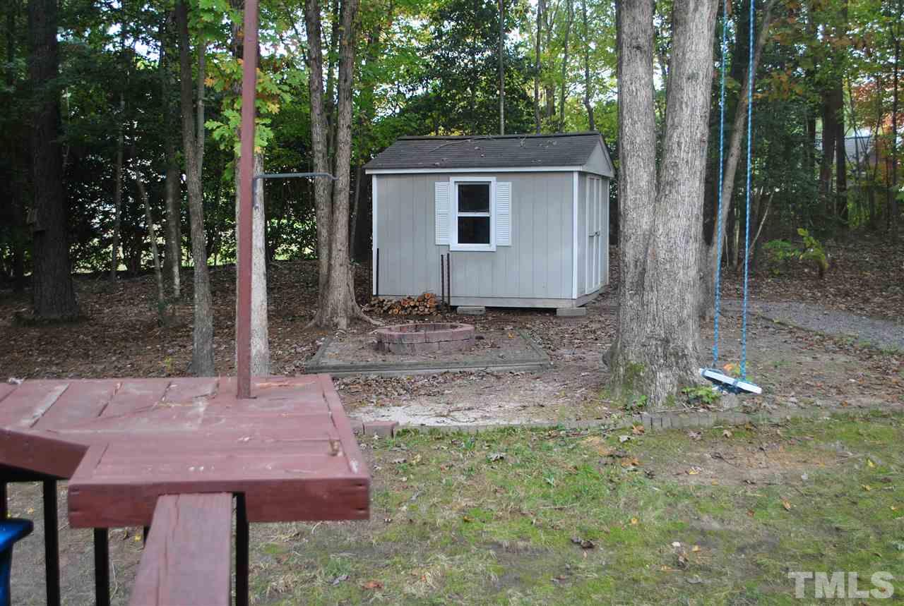 3424 Ribcowski Court Raleigh, NC 27616 - Photo 17 of 20 a backyard of a house with lots of green space