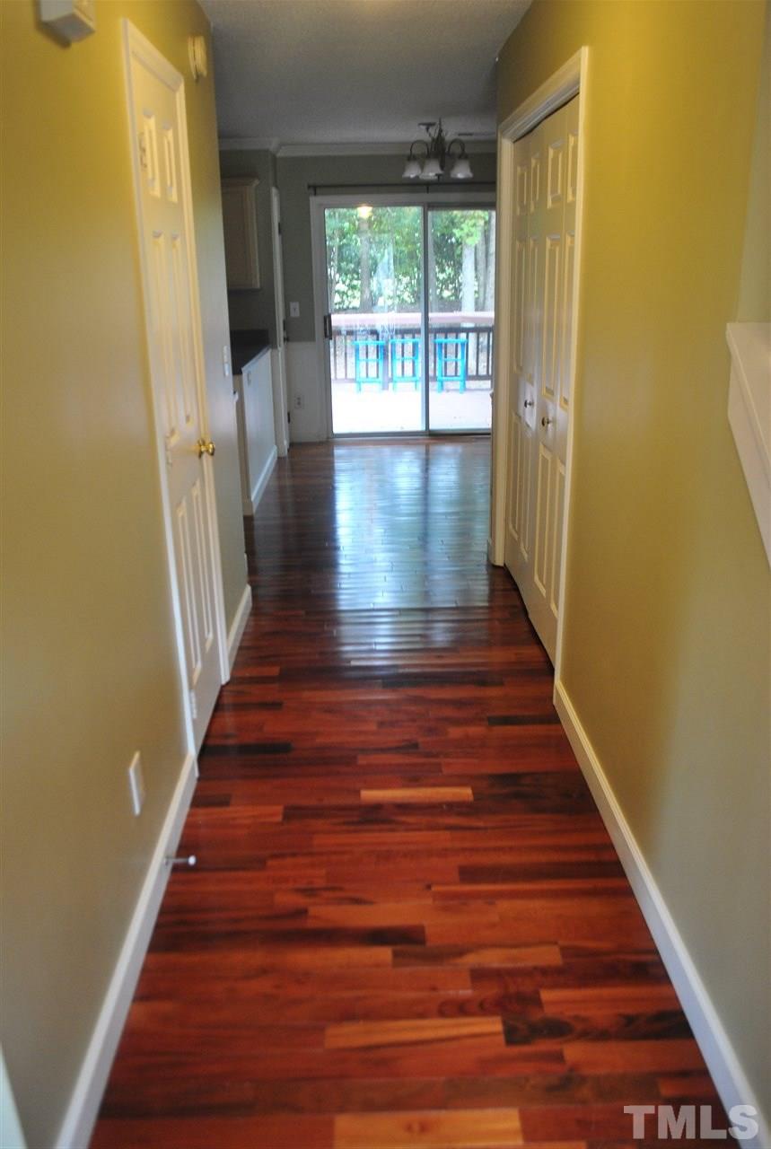 3424 Ribcowski Court Raleigh, NC 27616 - Photo 4 of 20 a view of entryway and hall with wooden floor