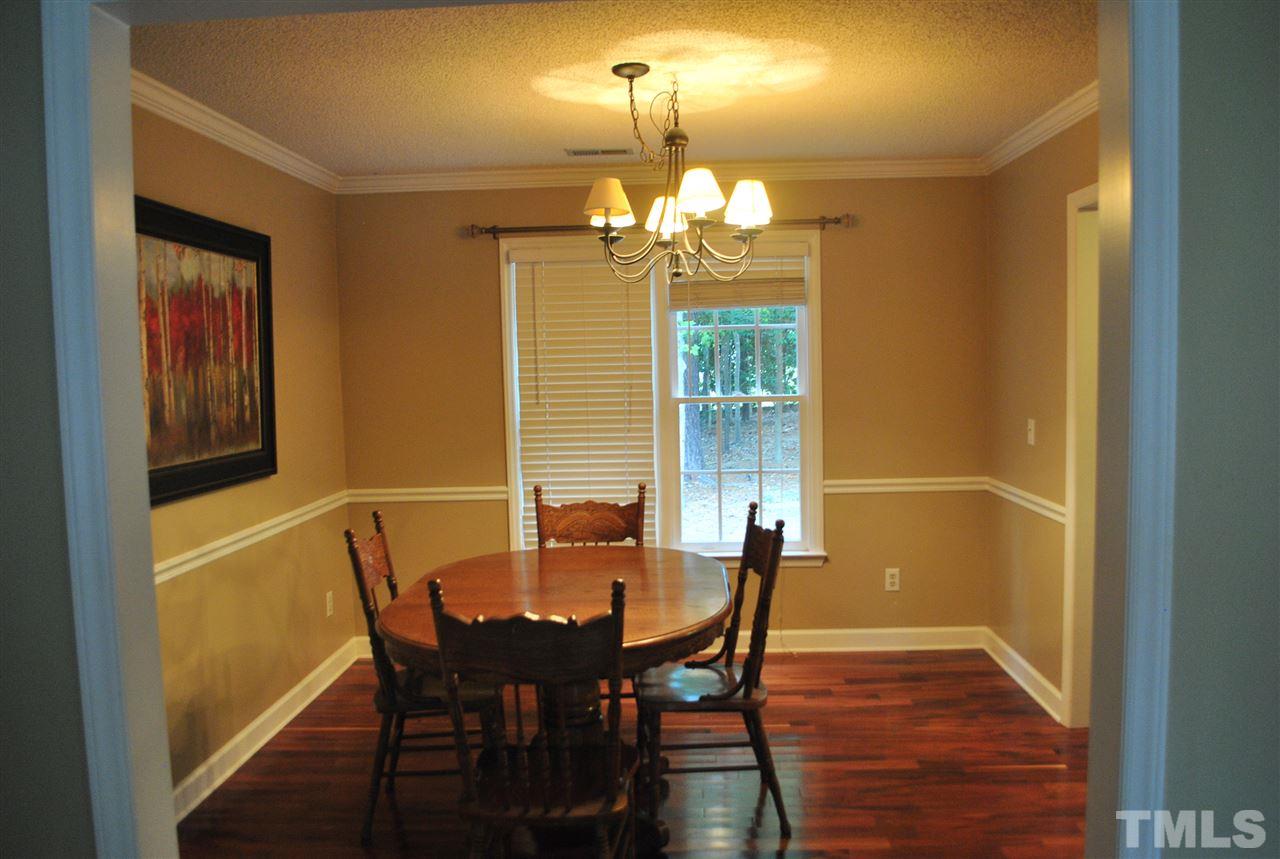 3424 Ribcowski Court Raleigh, NC 27616 - Photo 6 of 20 a view of a dining room with furniture and chandelier