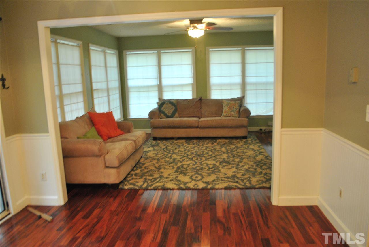 3424 Ribcowski Court Raleigh, NC 27616 - Photo 7 of 20 a living room with furniture and a large window