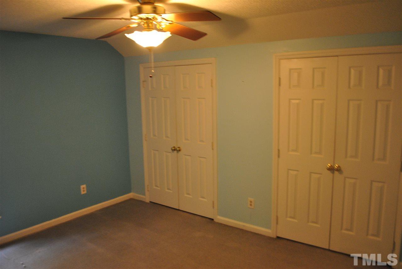 3424 Ribcowski Court Raleigh, NC 27616 - Photo 10 of 20 a view of a chandelier fan and closet in a room